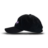 Black baseball cap with small purple logo, viewed from the side against a white background.