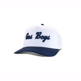 White and navy blue baseball cap with "Gas Boys" text embroidered in navy blue script lettering
