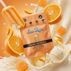 Gas Boys Orange Creamsicle gummy package with orange slices, ice cream, and milk on an orange background