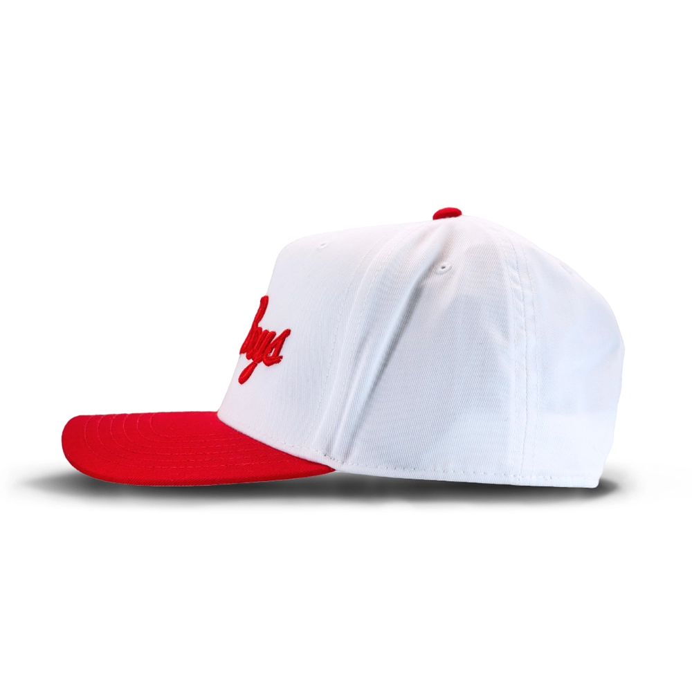 White baseball cap with red brim and red cursive logo, viewed from a side angle against a white background.